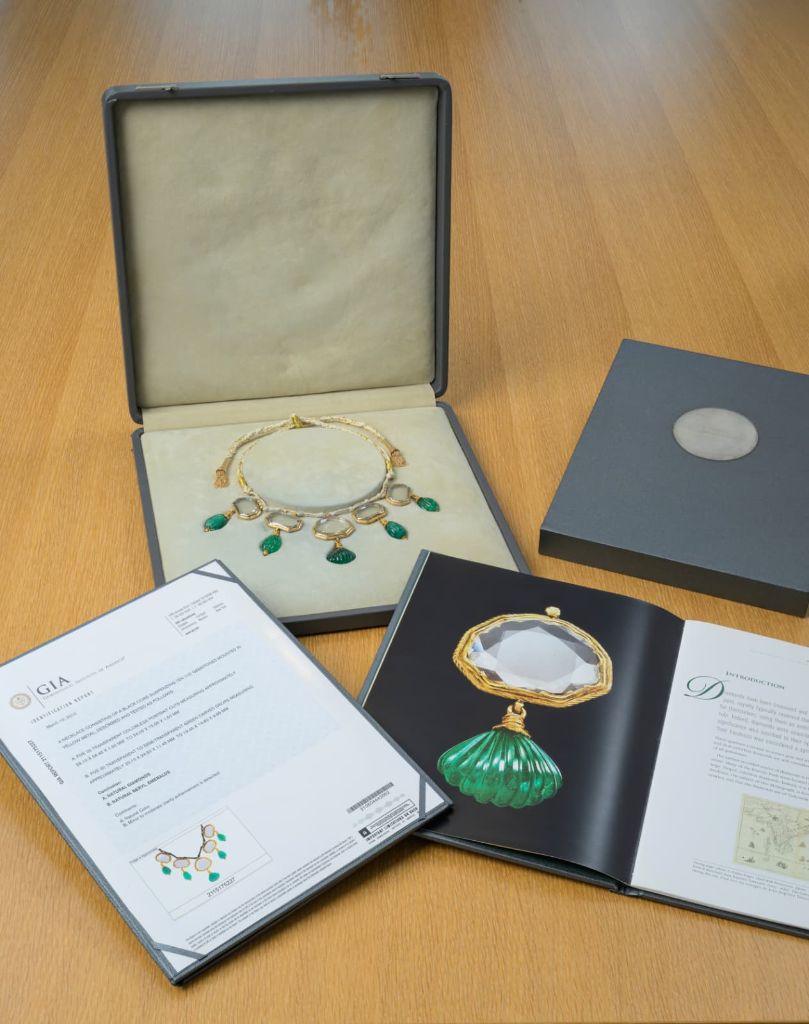 Presentation case with the necklace, GIA report, and printed scholarly documentation supporting the Dior citation.